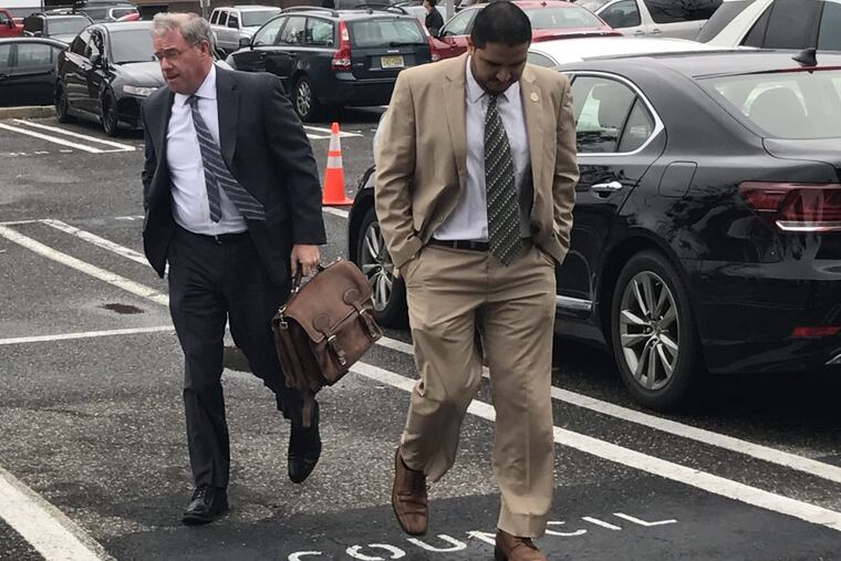 Jeffrey Chiesa, left, the state’s appointed overseer of Atlantic City, escorted by Chris Filiciello, the mayors chief of staff, into his first meeting at City Hall. AMY ROSENBERG / Staff .