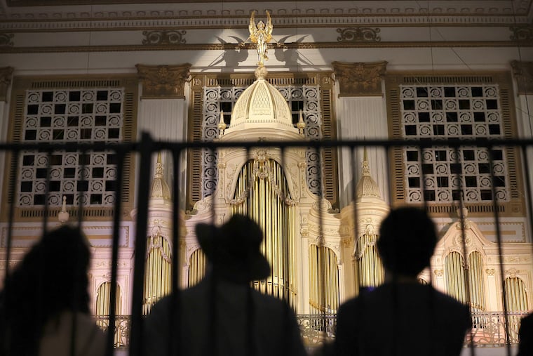 Listeners in the Wanamaker Grand Court on Sept. 7.