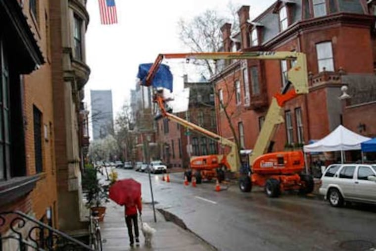 Crews taped Monday outside a mansion at 21st and Delancey. The block has been in such films as "The Sixth Sense" and "Trading Places." This shoot, including locations in Bensalem and at City Hall, has provided about 100 local jobs. (Michael S. Wirtz / Staff Photographer)