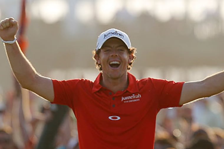 Rory McIlroy celebrates after hitting a birdie putt on the 18th green to finish off his PGA Championship victory. (Evan Vucci/AP)