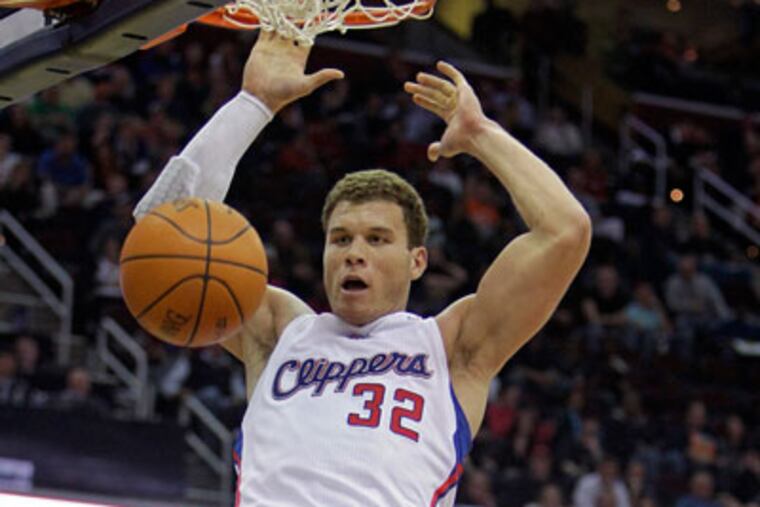 Blake Griffin and Chris Paul have formed a dangerous combination so far this season. (Mark Duncan/AP)