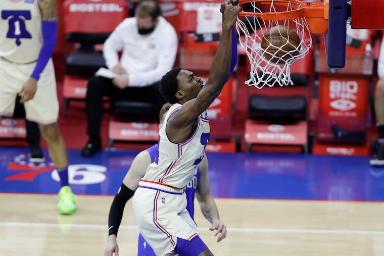 Sixers forward Paul Reed dunks the basketball past Orlando Magic forward Ignas Brazdeikis in the second quarter on Sunday, May 16, 2021.