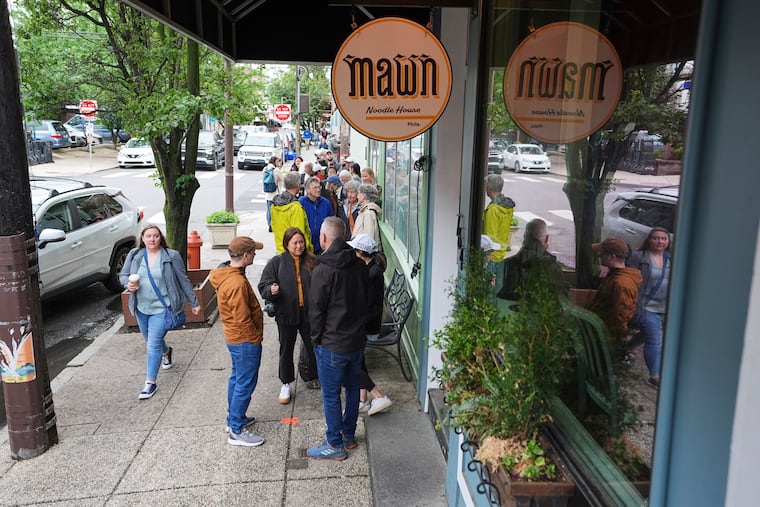 Customers wait in line outside Mawn for a chance to score a walk-in only table for lunch at the acclaimed Cambodian restaurant in South Philly.