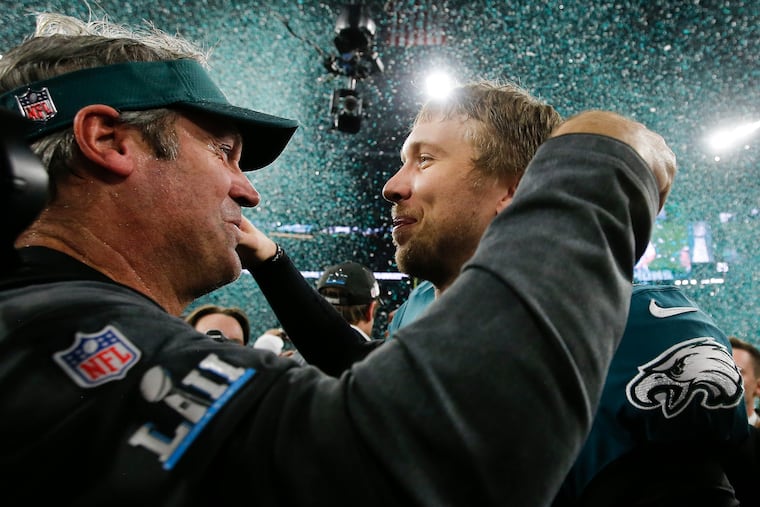 Former Eagles quarterback Nick Foles will forever be remembered for leading the Birds to their first Super Bowl title alongside former head coach Doug Pederson (left) in 2018.