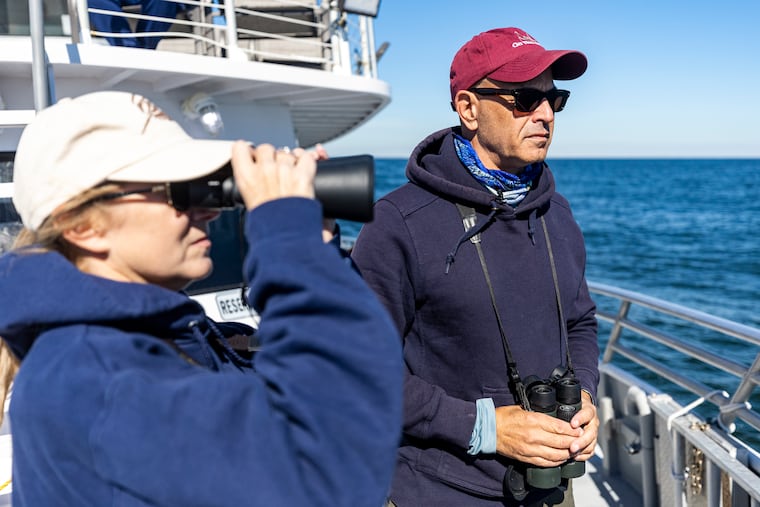 Captain Paul Eidman, with Anglers for Offshore Wind and Menhaden Defenders and Captain of Reel Therapy, looking for any signs of whale presents during the Jersey Shore Whale watch in Belmar, N.J., on Friday, Oct. 13, 2023.