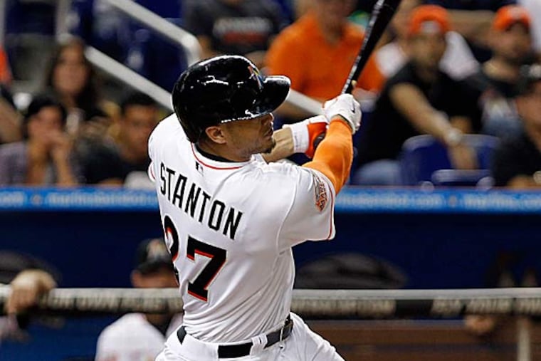 What owner Jeffrey Loria did in the span of 12 months was so ridiculous that it would be surprising if anyone showed up at Marlins Park this season to see Giancarlo Stanton. (Alan Diaz/AP file photo)