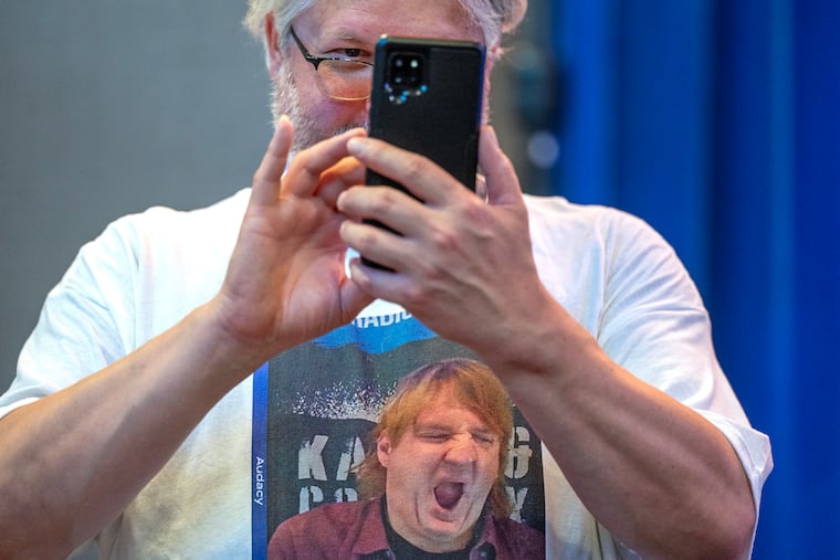 Kevin Puls records the scene before a campaign rally in Bucks County for State Treasurer Stacy Garrity, a GOP gubernatorial candidate, at the Newtown Sports & Events Center.