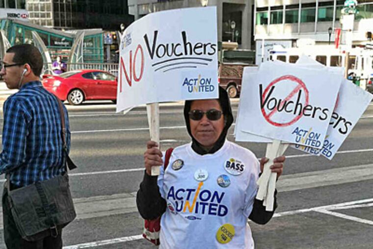 Anti-voucher parent Alicia Dorsey, of Mount Airy, protested at conference where Gov. Corbett spoke. (Peter Mucha / Inquirer Staff)