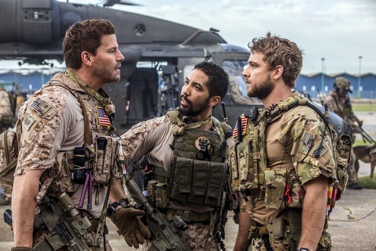 CBS’s “SEAL Team” stars David Boreanaz (left) with Neil Brown Jr., (center) and Max Thieriot.