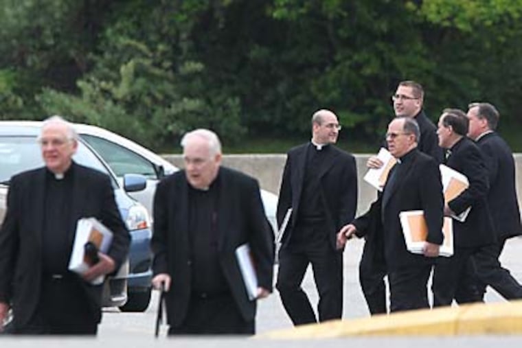 Archbishop Charles Chaput met with several hundred priests from the Archdiocese of Philadelphia on May 2, 2012, at Cardinal O'Hara High School in Springfield, PA. The meeting was behind closed doors, but the Archbishop is scheduled to make a public announcement on Friday. The priests are shown leaving the high school. ( Charles Fox / Staff Photographer )