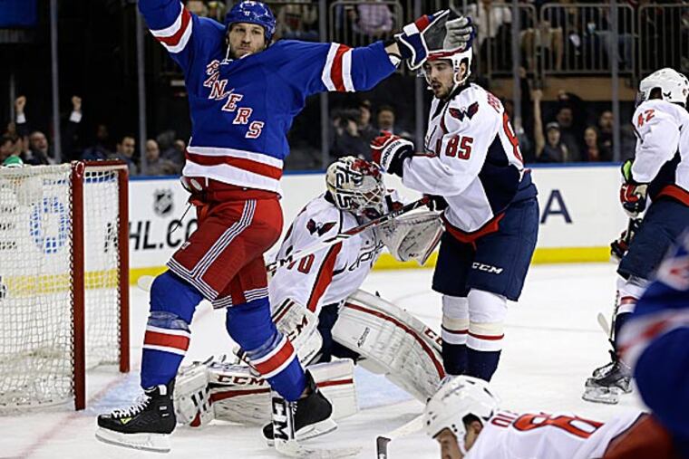 Rangers winger Ryane Clowe celebrates a goal by Carl Hagelin in the second period. (Kathy Willens/AP)