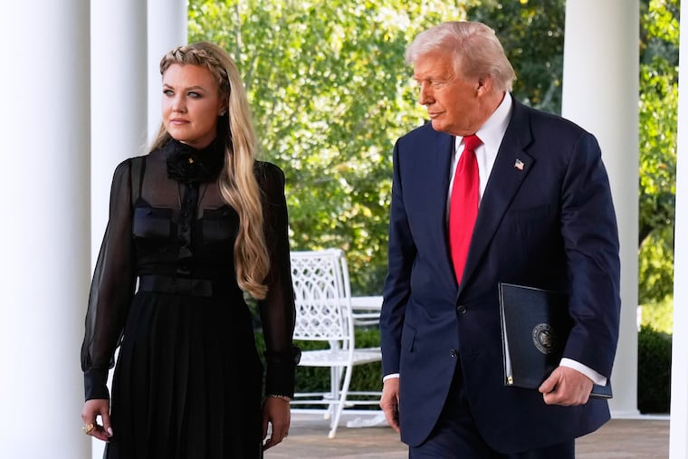 President Donald Trump, with Erika Kirk, walks out to present the Presidential Medal of Freedom for Charlie Kirk to his widow Erika Kirk, in the Rose Garden of the White House, Tuesday, Oct. 14, 2025, in Washington.