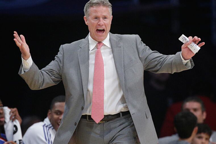Philadelphia 76ers head coach Brett Brown directs his team during the
first half of an NBA basketball game against the Los Angeles Lakers,
Sunday, March 22, 2015, in Los Angeles. (Jae C. Hong/AP)