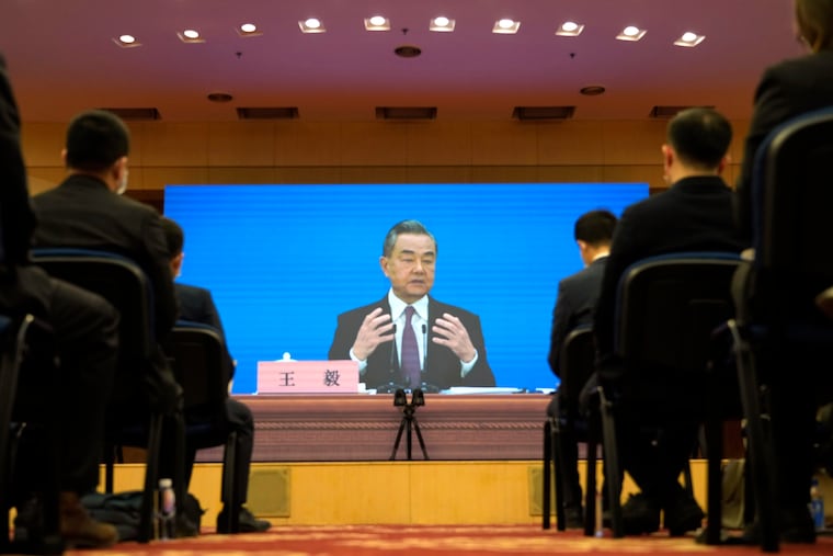 Chinese Foreign Minister Wang Yi speaks during a remote video press conference Monday.
