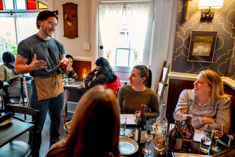 Lead server Kyle Massi talks with patrons at Gass & Main in Haddonfield, a participant in Haddonfield Restaurant Week.