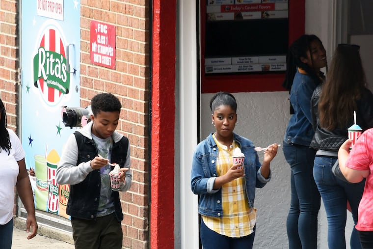 'This Is Us' star Lyric Ross (right) enjoys a water ice from Rita's while filming for season four of the NBC series on South Street.