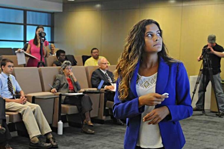 Valerie Nieves, 19, North Philadelphia, gives her business model presentation to a group of SAP employees Aug. 28, 2013 at SAP headquarters in Newtown Square. Nieves and SAP are participating in Networking for Teaching Entrepreneurship, which engages students from low-income neighborhoods who otherwise might not see much positive about being in school. Nieves will be making her real presentation in the national competition in NYC in October. ( CLEM MURRAY / Staff Photographer )