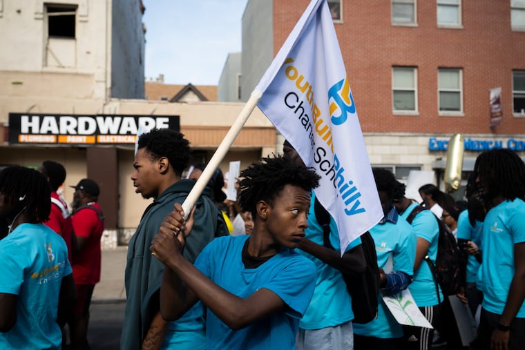 Shyeem Wilson, (center), an alum from class of 2025, joins students and faculty from Youth Build Philly charter school, march to the Philadelphia School District headquarters on Thursday, Aug. 28, 2025 in Philadelphia.