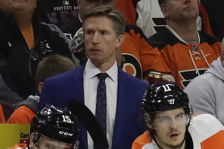 Under third-year Flyers coach Dave Hakstol (back), young players such as Travis Konecny (right) made major strides this season.
