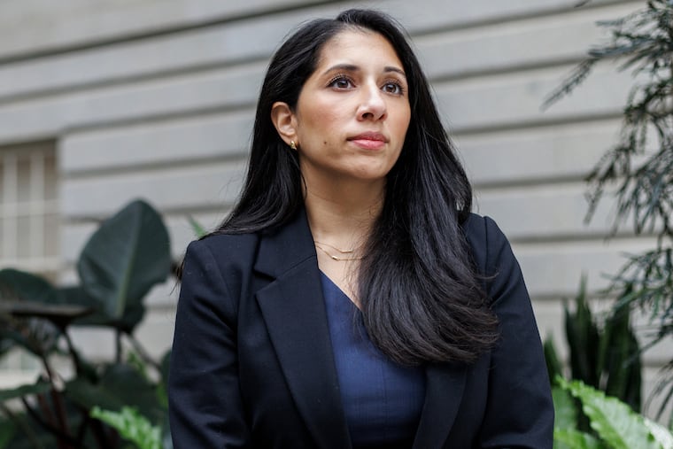 Anam Petit, a former Justice Department employee, poses in the Robert and Arlene Kogod Courtyard at the National Portrait Gallery in Washington, Friday, Jan. 9, 2026.