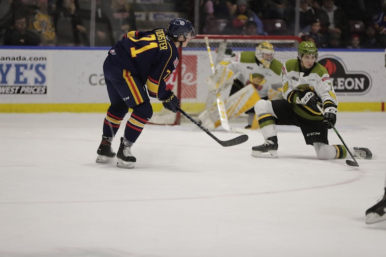 Right winger Tyson Foerster (left), selected by the Flyers in the first round, lines up a shot from his office, the left circle.