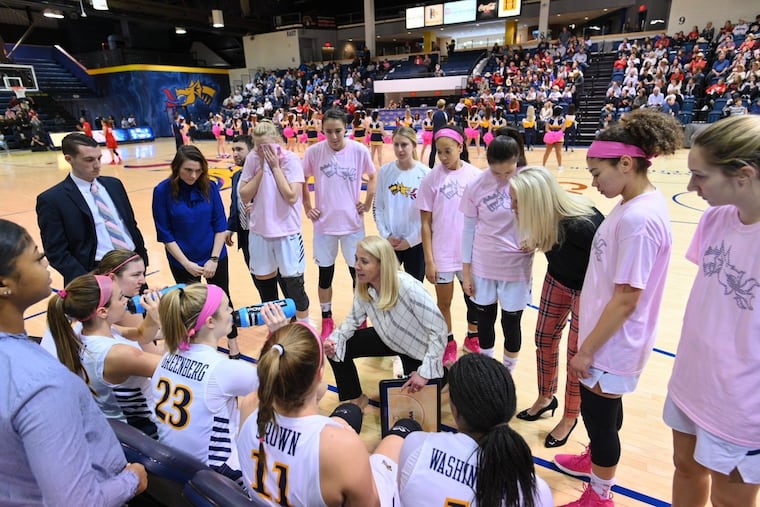 Denise Dillon talks to her players during a timeout.