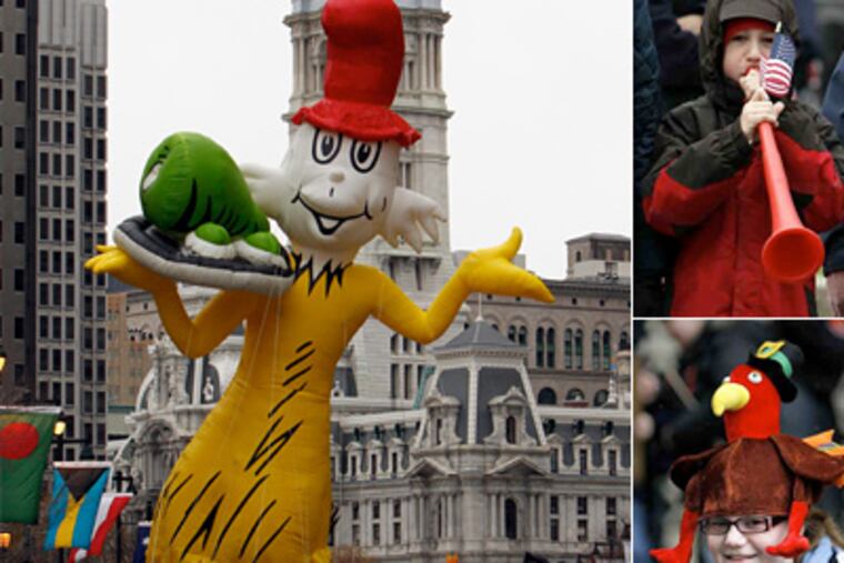 Sam I Am makes his way down the Parkway while John Sokoloski, 9, and Savannah Hehn, 14, watch the annual Thanksgiving Day Parade. (Laurence Kesterson / Staff Photographer)