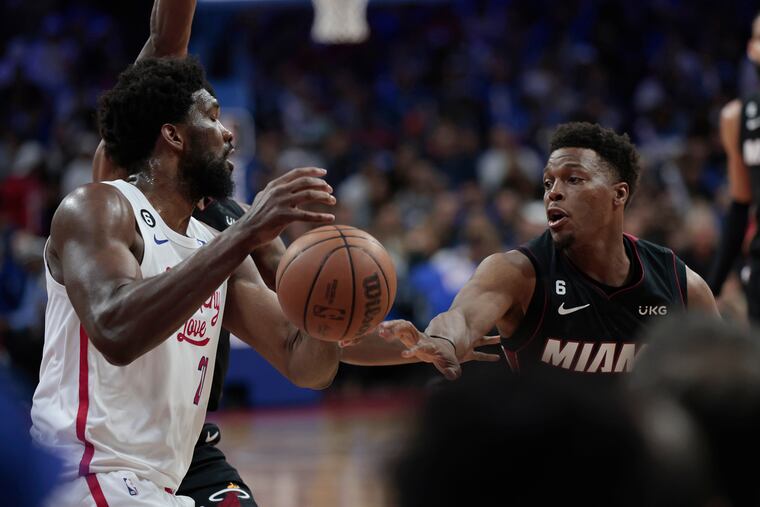 Miami’s # 7 Kyle Lowry knocks the ball away from Sixers’s Joel Embiid in the third quarter of the Miami Heat at the Philadelphia 76ers NBA game at the Wells Fargo Center in Phila., Pa. on April 6, 2023.