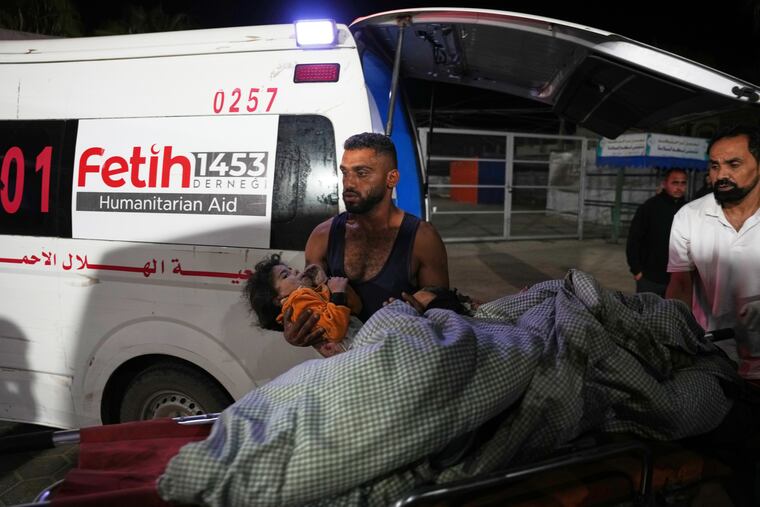 Palestinians injured in an Israeli army strike are brought to Al-Aqsa Hospital in Deir al-Balah, Gaza Strip, on Wednesday, Oct. 29.