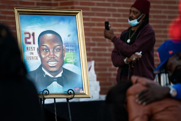 A painting of Ahmaud Arbery is displayed during a vigil at New Springfield Baptist Church in Waynesboro, Georgia.