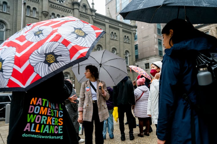 Domestic workers gather outside City Hall on Jan. 25, 2024, before heading into City Council to ask members for their support. Arnetta Anderson, a domestic worker and caregiver in Philadelphia, argues that Mayor Cherelle L. Parker can do more to help domestic workers in the city.