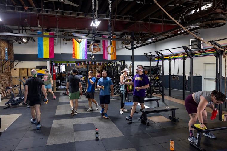 Members of the Novem Community Fitness wrap up their workouts and clean up North Philadelphia gym on Friday.