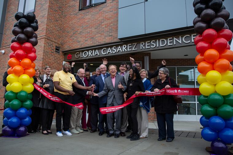 A ribbon cutting takes place outside the first-ever Pennsylvania residence for LGBTQ homeless people in North Philadelphia.