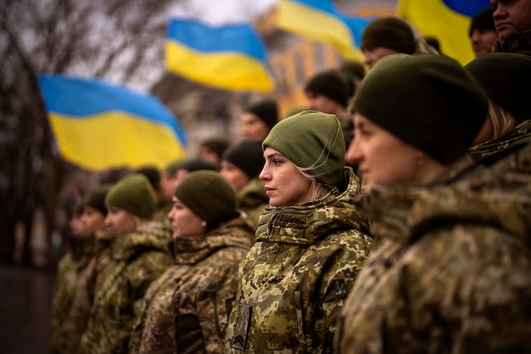 Ukrainian Army soldiers pose for a photo as they gather to celebrate a Day of Unity in Odessa, Ukraine, on Wednesday.