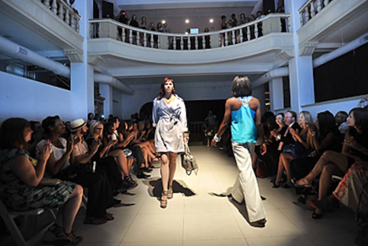 Wilhemina models Natalie Irvin (left) and AJ Scott make their way down the runway at Trust. (Sharon Gekoski-Kimmel / Staff)