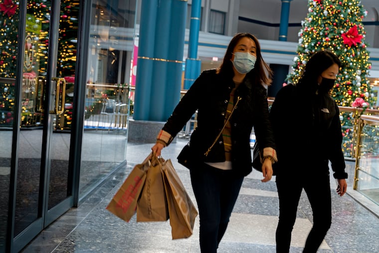 Shoppers (no IDs) at the Shops at Liberty Place Nov.14, 2021. Health experts are telling us it's safe to gather this Christmas with family and friends, as long as people are vaccinated. So now comes something else to kill the joy of the holiday season: inflation.