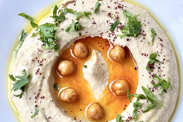The Turkish-style hummus at Kanella Restaurant has both fresh and roasted garlic, well-balanced spices and finishing gloss of chili oil.