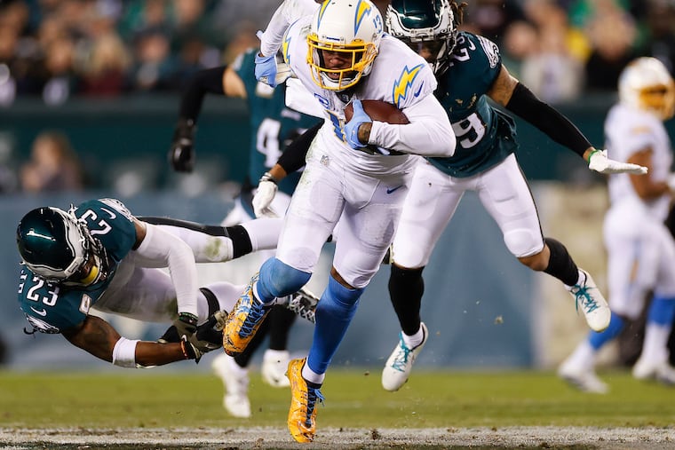 Los Angeles Chargers wide receiver Keenan Allen runs with he football past Eagles safety Rodney McLeod (left) and cornerback Avonte Maddox in the third quarter on Sunday, November 7, 2021 in Philadelphia.