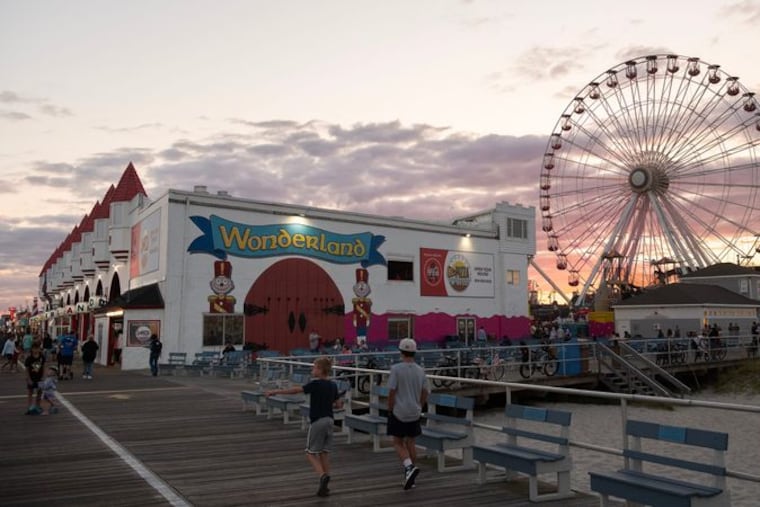 Boardwalk visitors stroll past Gillian's Wonderland Pier in Ocean City on Tuesday, August 20, 2024.