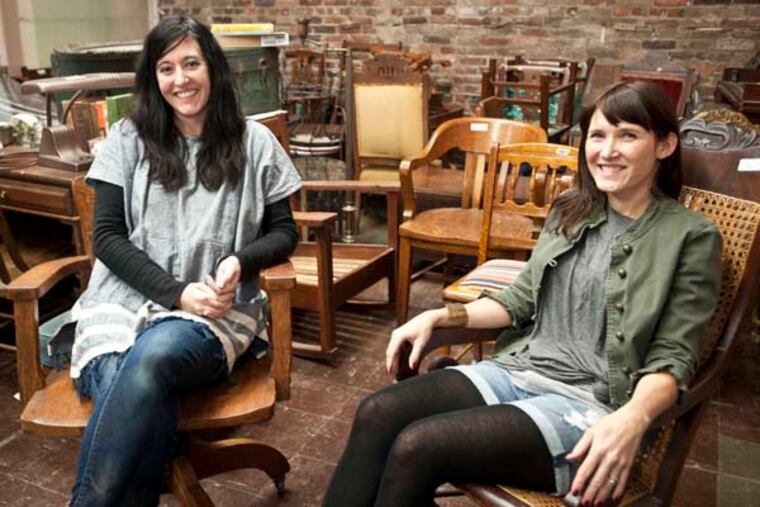Kristy Olsyn, (left) and Laura Thieme of Moon and Arrow in the backroom where the refinish their goods. ( RON TARVER / Staff Photographer )