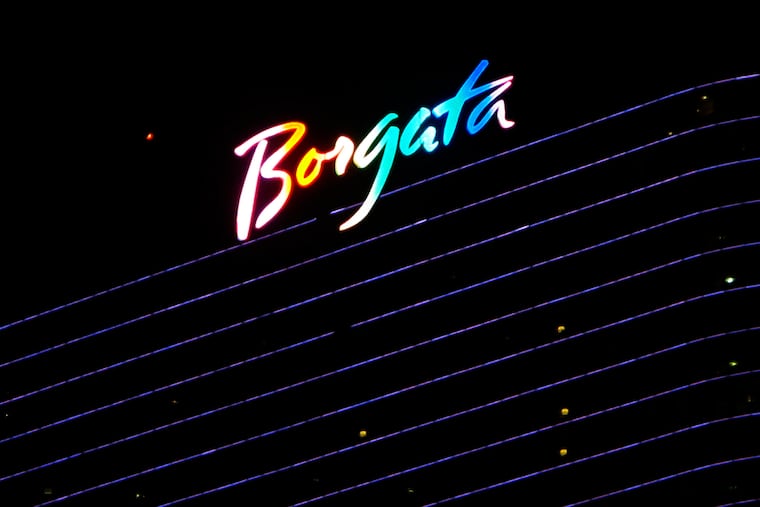 FILE - This June 24, 2016 file photo shows the illuminated logo at the top of the Borgata casino in Atlantic City, N.J. New Jersey regulators have seized more than $107,000 won by underage or otherwise prohibited gamblers at Atlantic City's Borgata casino. The action made public recently by the state Division of Gaming Enforcement also includes an $81,000 fine for the Borgata's online gambling partner, bwin.party.