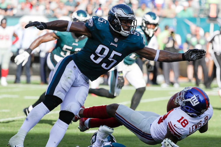 Eagles outside linebacker Mychal Kendricks stops New York Giants wide receiver Roger Lewis during fourth-quarter on Sunday, September 24, 2017 in Philadelphia