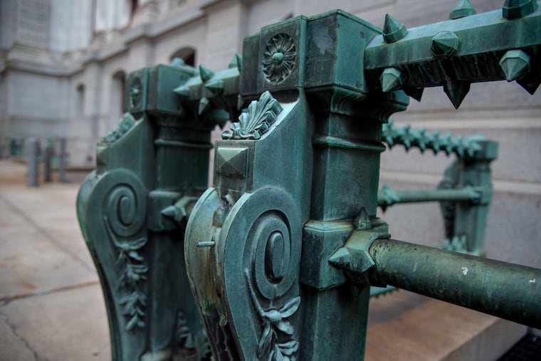 There were once almost 150 small lion heads on the ornate bronze spiked railing that surrounds City Hall. They, like most of the statuary on the building — including the big one of William Penn — were designed by Alexander Milne Calder. Fewer than two dozen of the lions remain after 100 years.