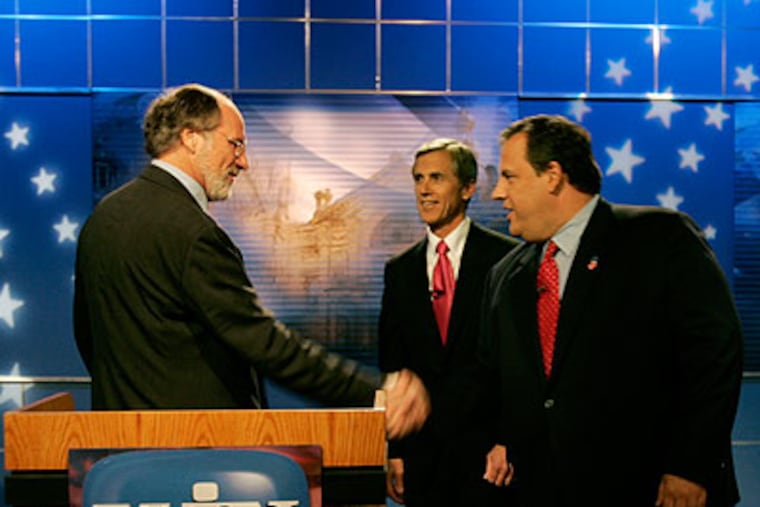 New Jersey Gov. Jon S. Corzine, left, greets Republican challenger Chris Christie as Independent candidate Chris Daggett, center, looks on before their debate Thursday in Trenton, N.J. (AP Photo / Mel Evans)