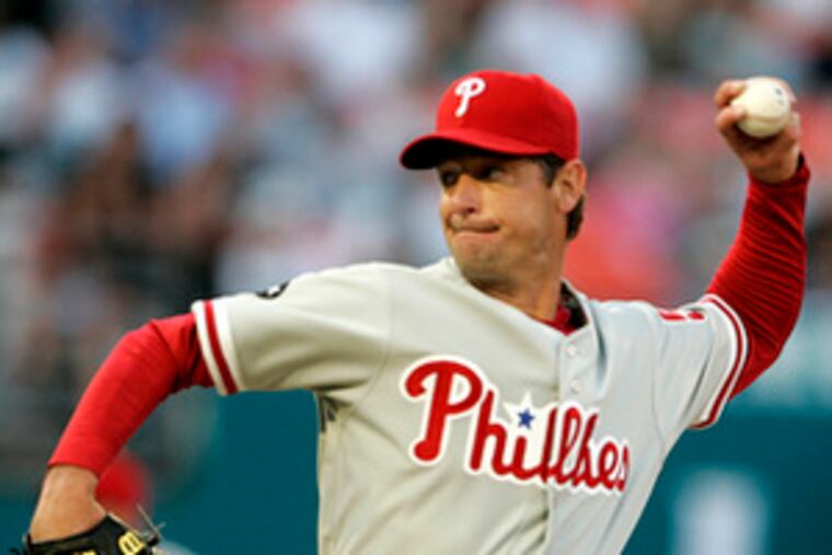 Jamie Moyer makes pitch in first inning of victory over Marlins, the Phils' first win of the season.