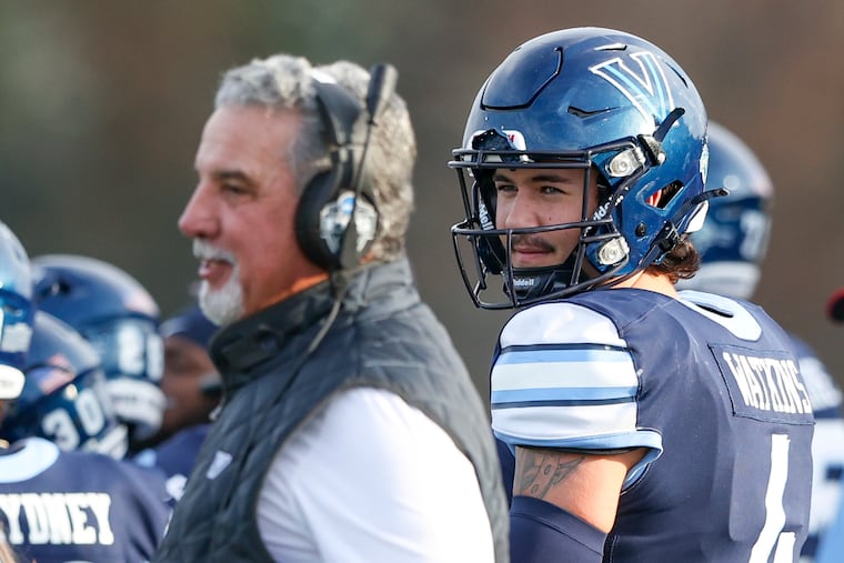 Villanova quarterback Connor Watkins (right) is the CAA's preseason offensive player of the year.