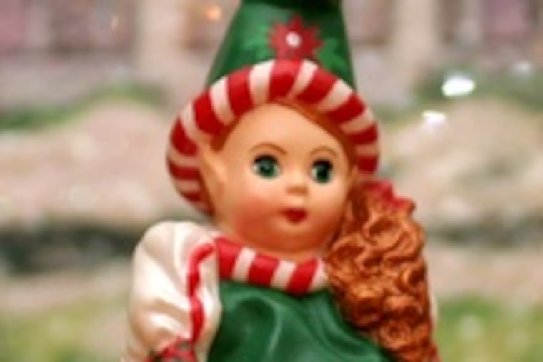 Keirnan's seven Christmas trees are just a backdrop for her elf collection, which includes, from left, a 2-inch-tall Madame Alexander elf, a "Gypsy Elf," and an elf named Jolly.