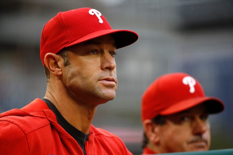 Phillies manager Gabe Kapler stands in the dugout in the third inning of the team's loss to the Nationals on Thursday.