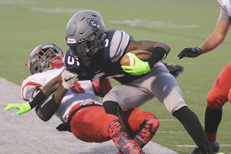 Vineland’s Nihym Anderson makes a tackle last season vs. St. Augustine.