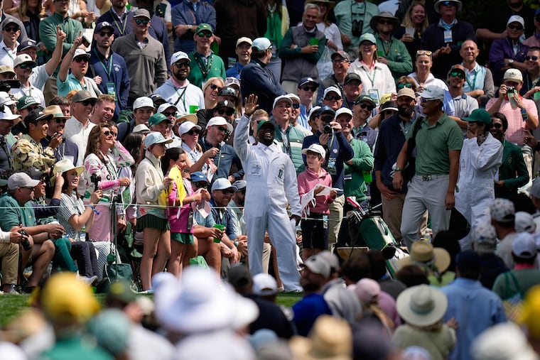 Kevin Hart waves on the sixth hole during the Par-3 Contest at the Masters on Wednesday.